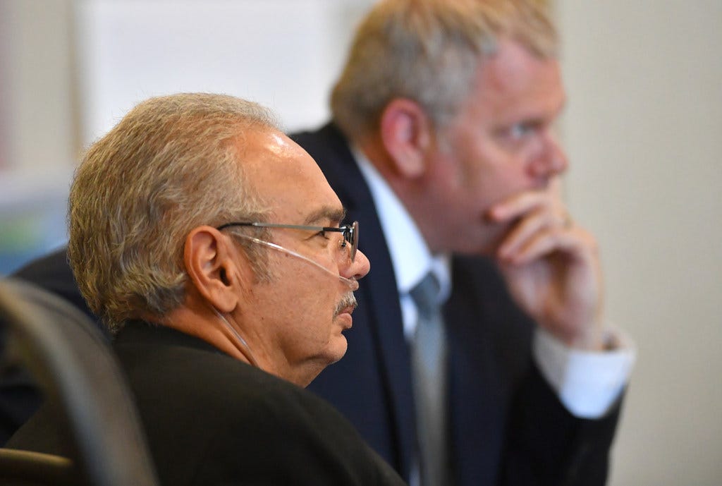 Gilberto Rios, left, and his attorney Jeff Young listen to testimony in court.