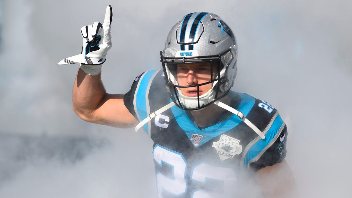 Carolina Panthers running back Christian McCaffrey (22) runs on to the field before the game at Bank of America Stadium.