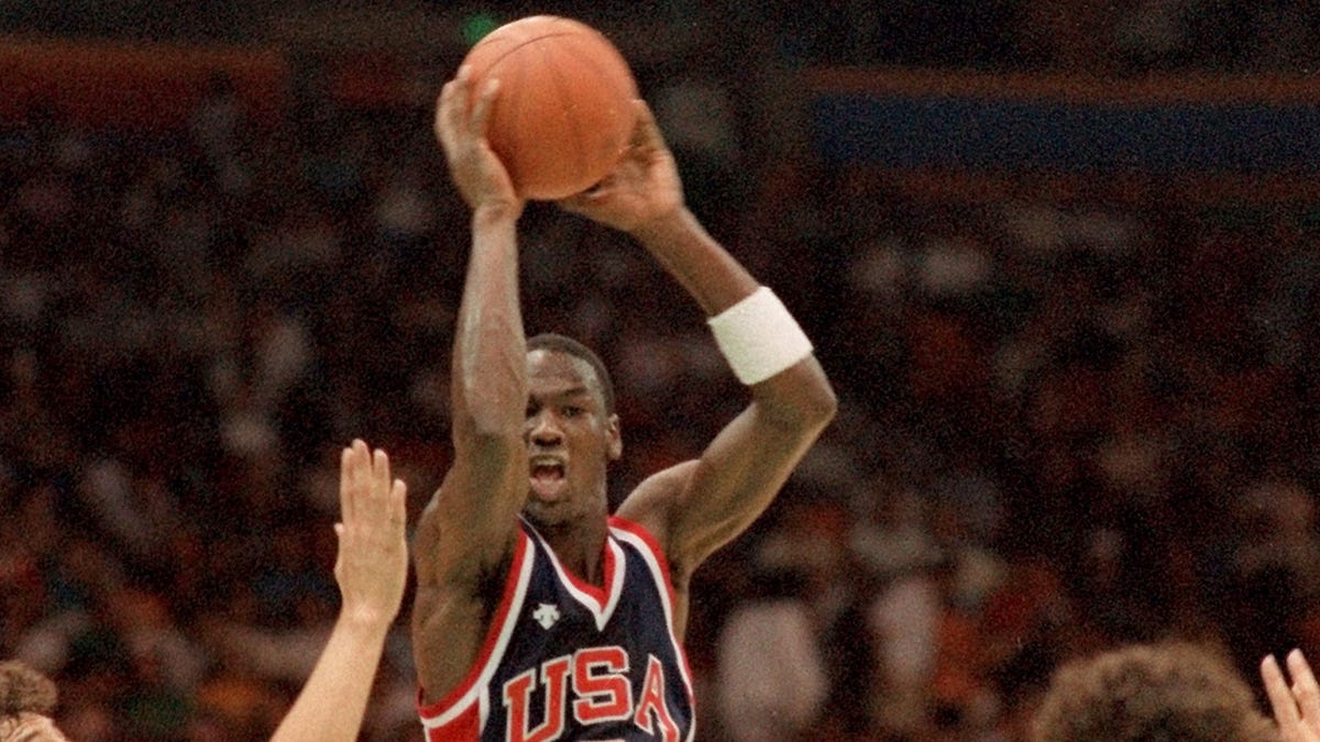 Michael Jordan, playing for Team USA during the 1984 Summer Olympics, goes up for a shot against Uruguay in a preliminary round game at in Long Beach, Calif.