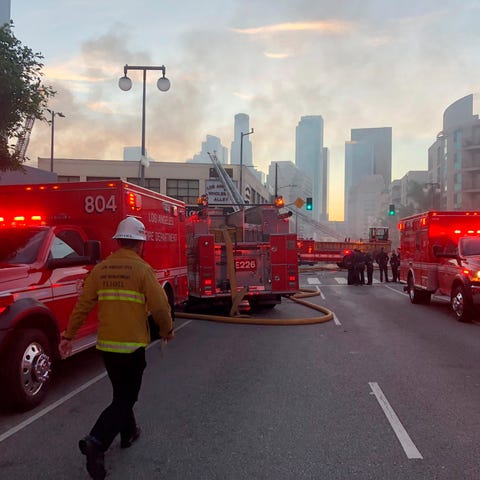 Firefighters respond to an explosion in downtown L