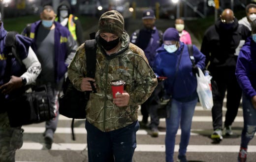 Autoworkers arrive to start their shifts at the FCA plant on Mound road Monday, May 18, 2020. The industry was shut down by Gov. Gretchen Whitmer due to the COVID-19 virus today was the first day back at work.