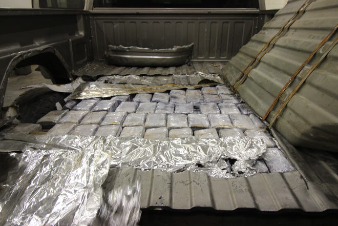 The bed of this pick-up truck contained 305 neatly wrapped bundles of marijuana.