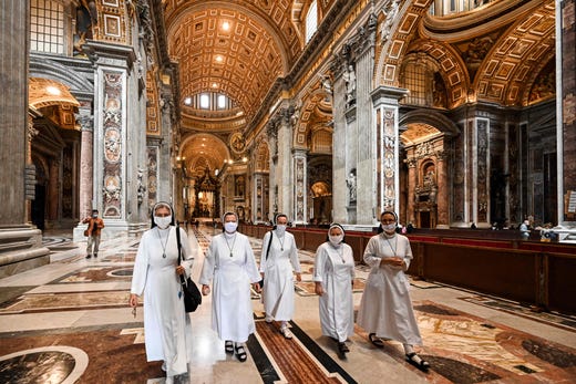 Nuns visit St. Peter's Basilica as it reopens on May 18, 2020 in The Vatican during the lockdown aimed at curbing the spread of the COVID-19 infection, caused by the novel coronavirus.
