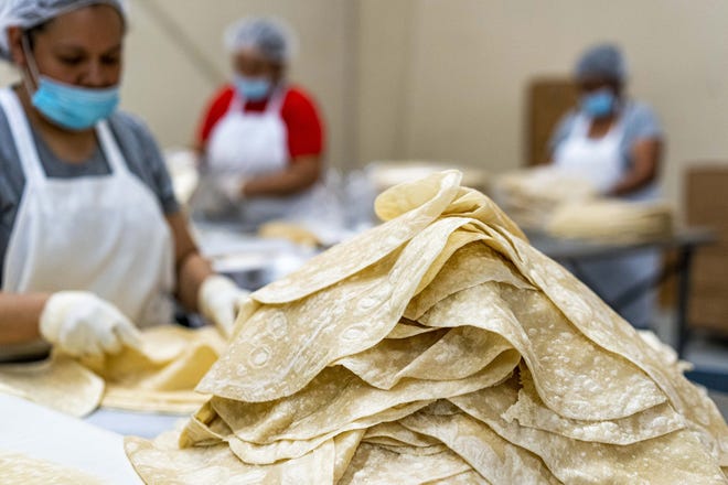 Employees packs tortilla at La Sonorense Tortilla Factory in Phoenix, Az. The Hernandez family has operated La Sonorense Tortilla Bakery in south Phoenix for more than 30 years.