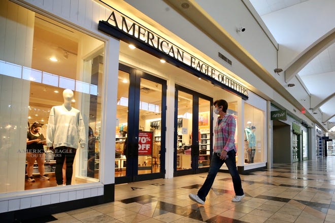 A shopper walks by American Eagle Outfitters inside Florence Mall, Wednesday, May 20, 2020, in Florence, Ky.