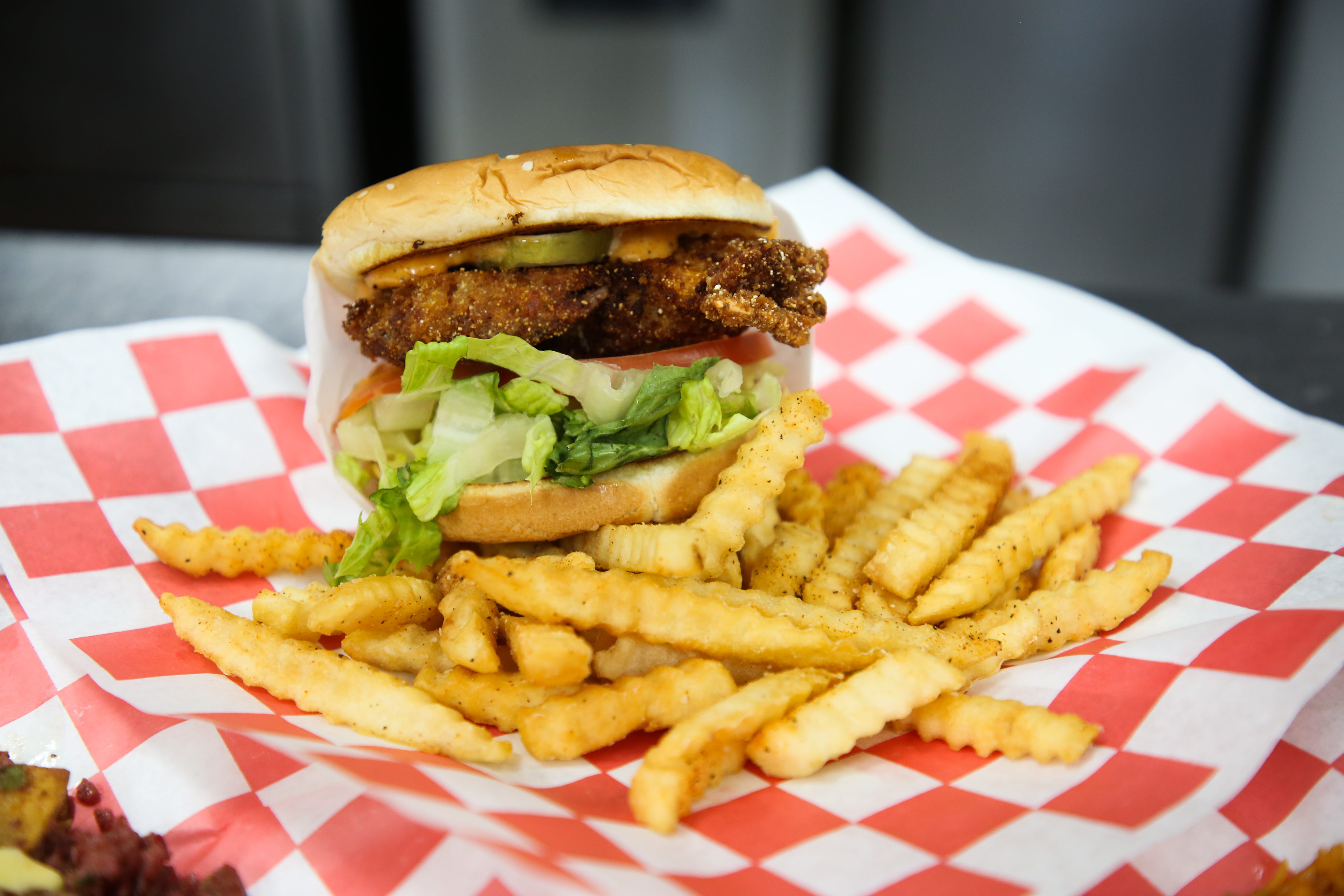 A soft shell crab po'boy is prepared at Southern Belle Cafe during the coronavirus pandemic on Tuesday, May 19, 2020 in Cathedral City, Calif.