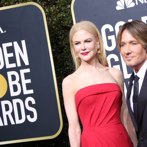 Nicole Kidman, left and Keith Urban arrive on the 