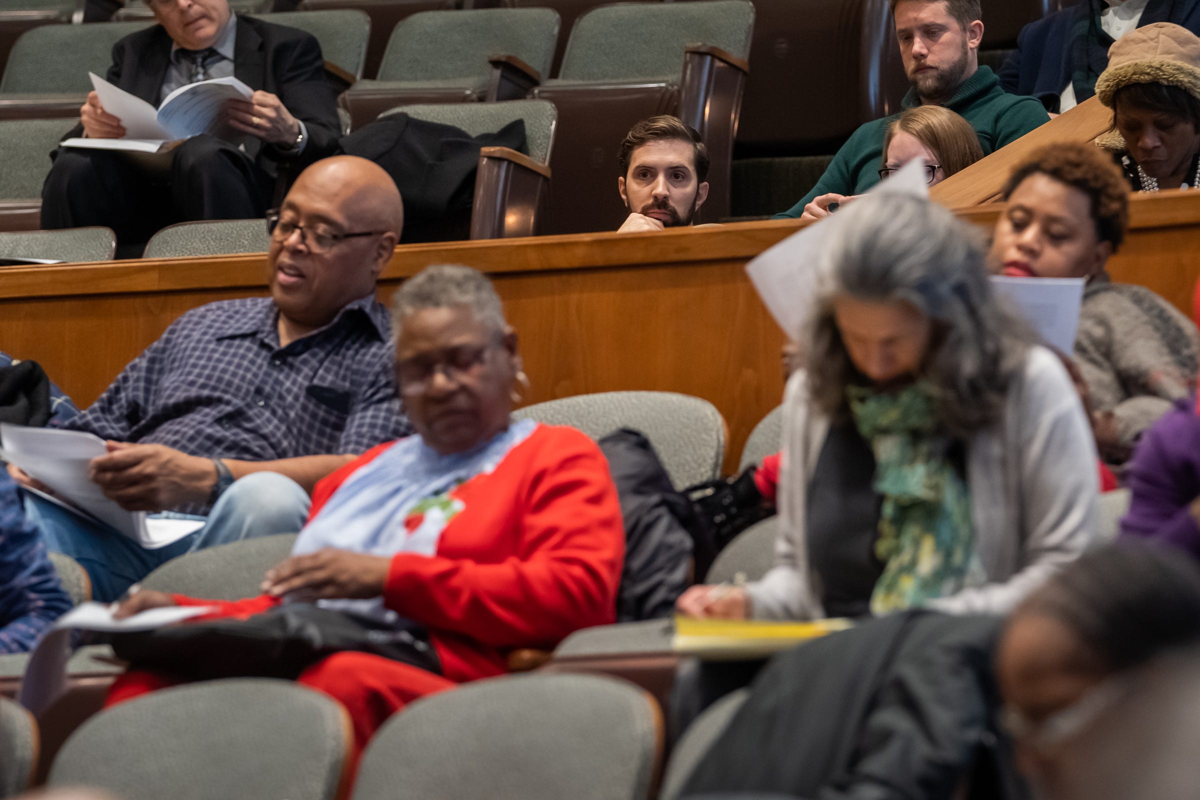Adam Schloff (center), director of development for Astral Weeks, listens during a Detroit City Council meeting as he sought a brownfield tax abatement worth $276,897 for the 2119 Field Street Project on Tuesday, Feb. 18, 2020.