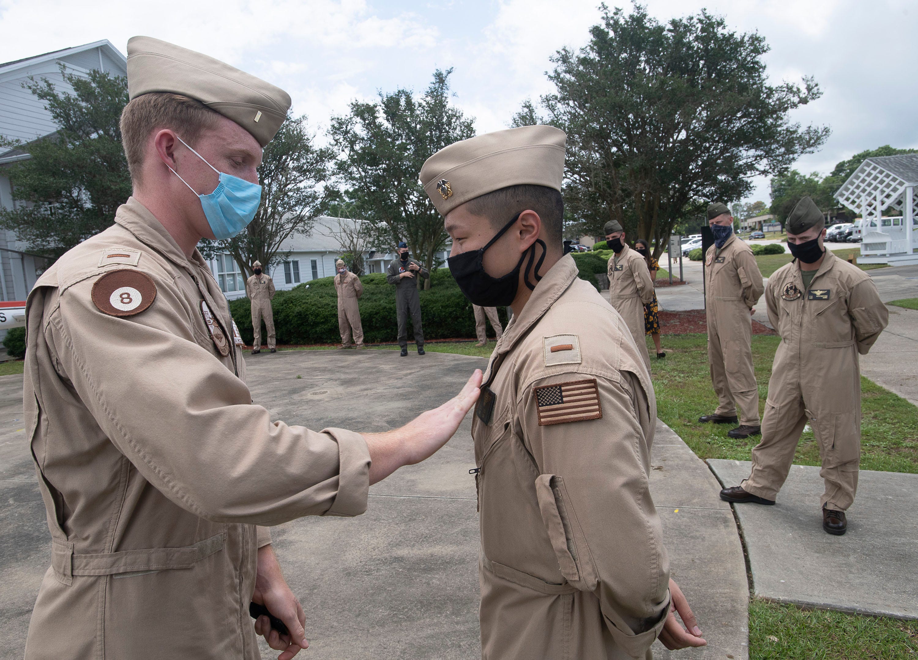 Navy honors naval aviators with wings of gold at limited ceremonies