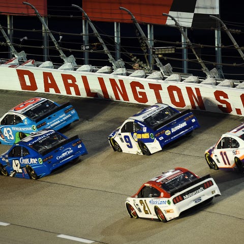 Drivers race around the turn during Wednesday nigh
