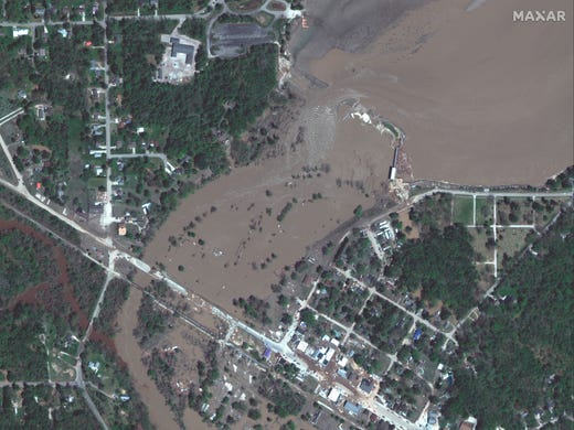 This photo provided by Maxar Technologies shows Sanford Dam in Sanford, Mich., Thursday, May 21, 2020, after it was damaged.