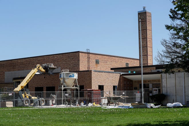 Construction equipment surrounds Waters Elementary School on Wednesday, May 20, 2020, in Fond du Lac, Wis., as part of a $98 million referendum project to make improvements to four Fond du Lac schools.
