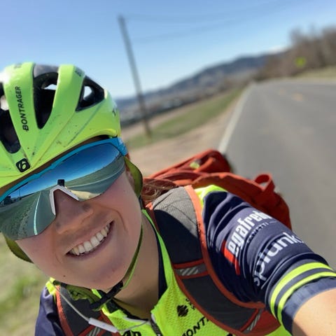 Olympic cyclist Ruth Winder takes a photo while ri