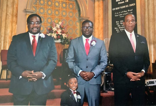 Larry Harris (right) is the best man for Marshall Hatch (left) for his wedding vow renewal in Chicago, Ill. in Sept., 2003. Hatch's nephew, Lil Rel Howery (center), and Howery's son attend the renewal.