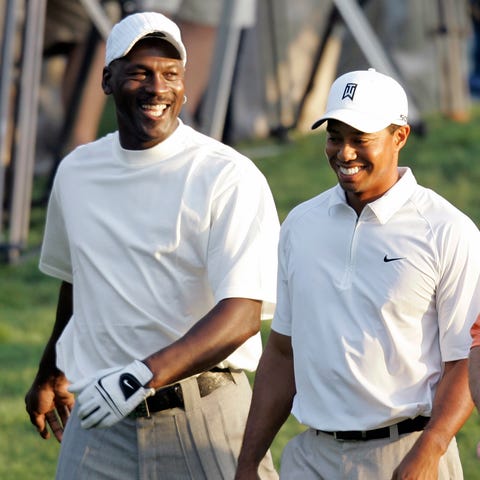 Tiger Woods, right, and Michael Jordan, left, shar
