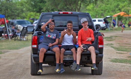 Young people flock to a recreation area at Lake Nasworthy during Memorial Day weekend on Saturday, May 23, 2020.
