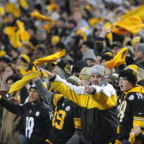 Pittsburgh Steelers fans wave their Terrible Towel