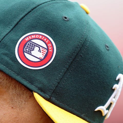 Oakland A's pitcher Frankie Montas wears a hat com