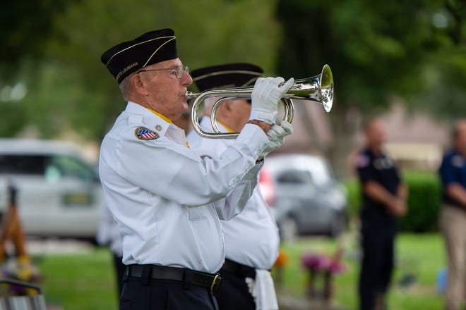 Adam Mouton playing bugle during Memorial Day Service at Fountain Memorial Cemetery. Monday, May 25, 2020.