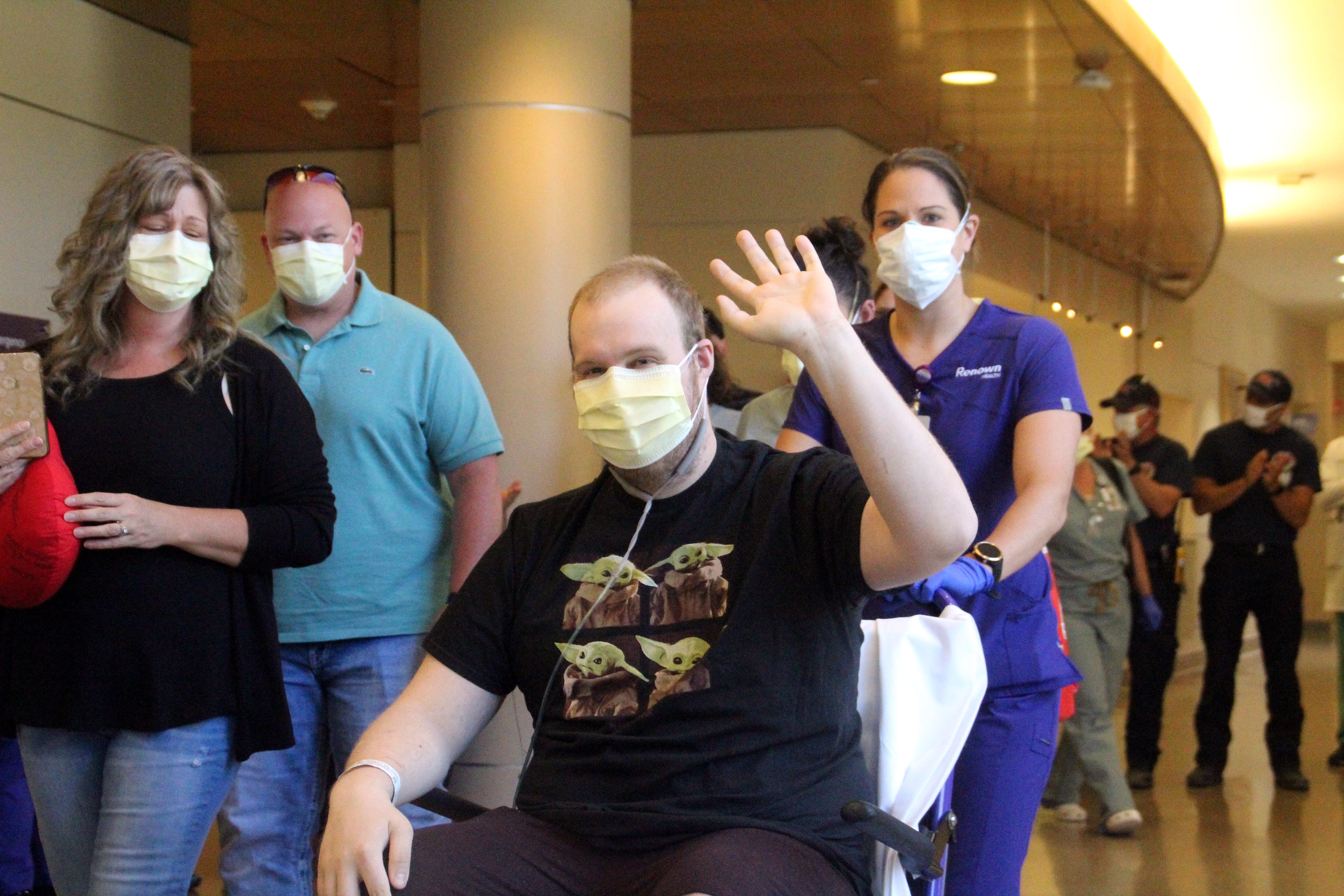 Austin Meegan waves as he is discharged from Renown Regional Medical Center on May 25, 2020 after being treated for COVID-19.