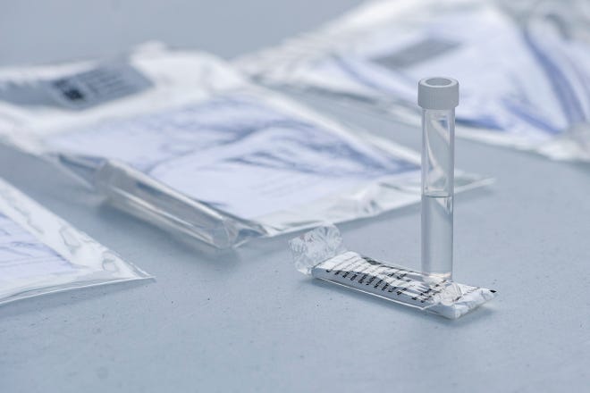 A COVID-19 nasal swab test is laid out on a table for a photo at a Buncombe County testing site on Coxe Avenue on May 26, 2020. 