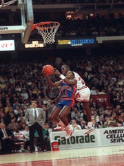 Pistons guard Isiah Thomas (11) didn't get along well with Bulls star Michael Jordan.