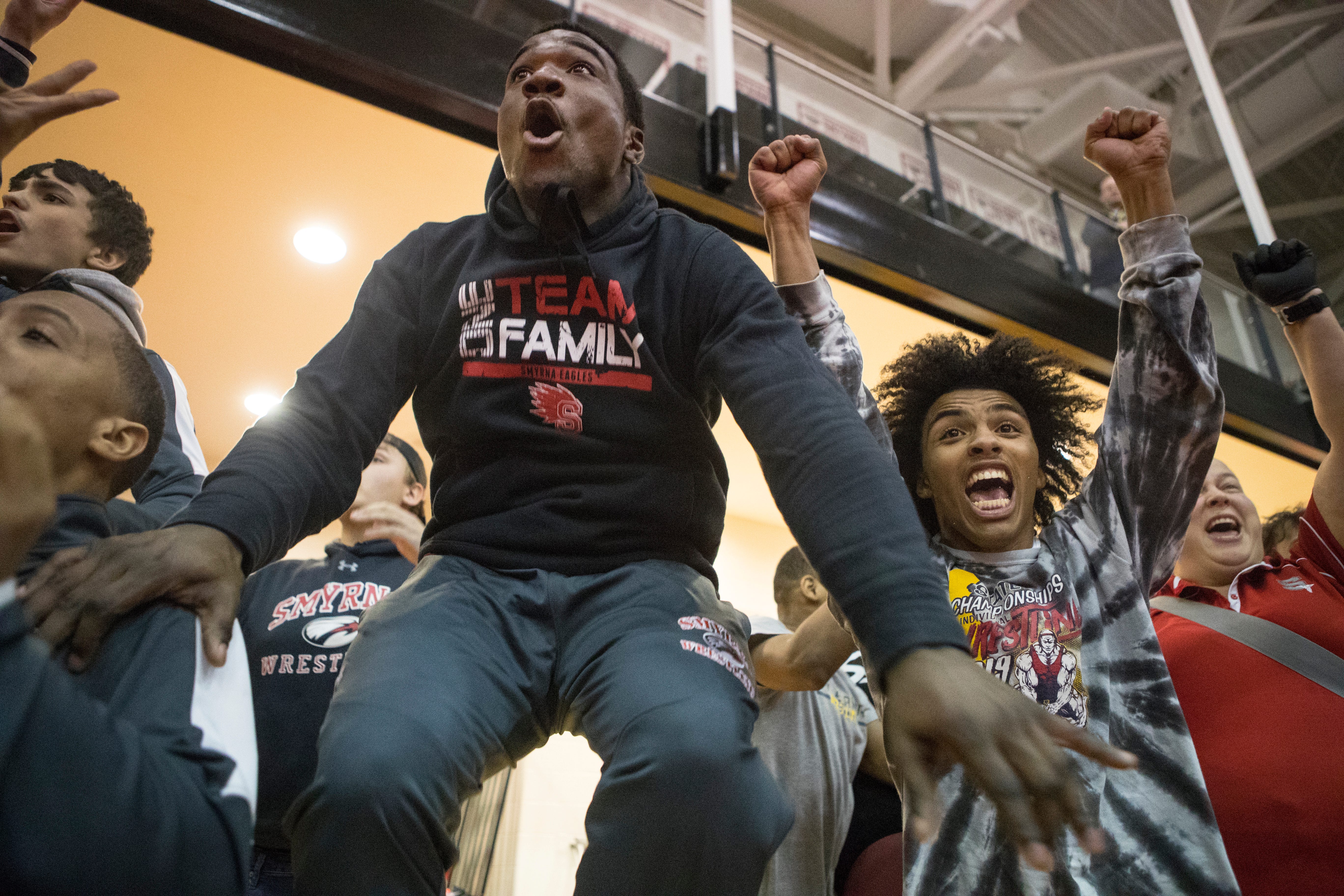 Hugo Harp, left, jumps in excitement as Smyrna wins the  DIAA Dual Team Wrestling Championship Saturday, Feb. 15, 2020, at Smyrna High School. 