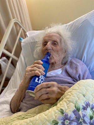 Jennie Stejna is treated to a cold Bud Light to celebrate her recovery from coronavirus.