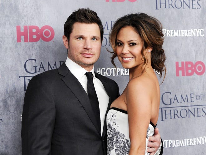 A March 18, 2014 file photo shows television personalities Nick Lachey, left, and his wife Vanessa Lachey at HBO's "Game of Thrones" fourth season premiere in New York. ABC announced Sept. 6, 2017, that the couple would compete on "Dancing with the Stars."