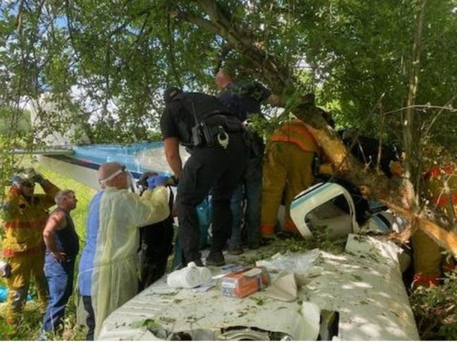 Emergency responders from the Cambridge Fire Department, United Ambulance and the Guernsey County Sheriff's Office joined forces with civilians to free a Michigan man from the heavily-damaged Beech 35-A33 he was piloting after it crashed near a field near Cambridge on Wednesday, May, 27, 2020.