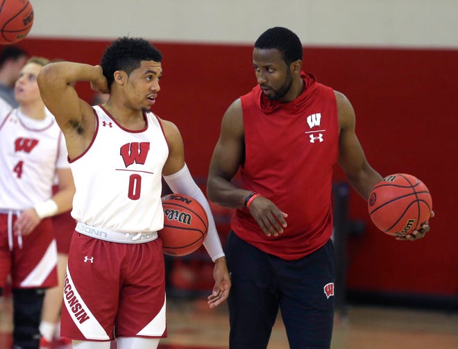 Wisconsin basketball assistant and former All-American Alando Tucker (right) voiced his anger on Instagram over the death of George Floyd at the hands of a Minneapolis police officer.
