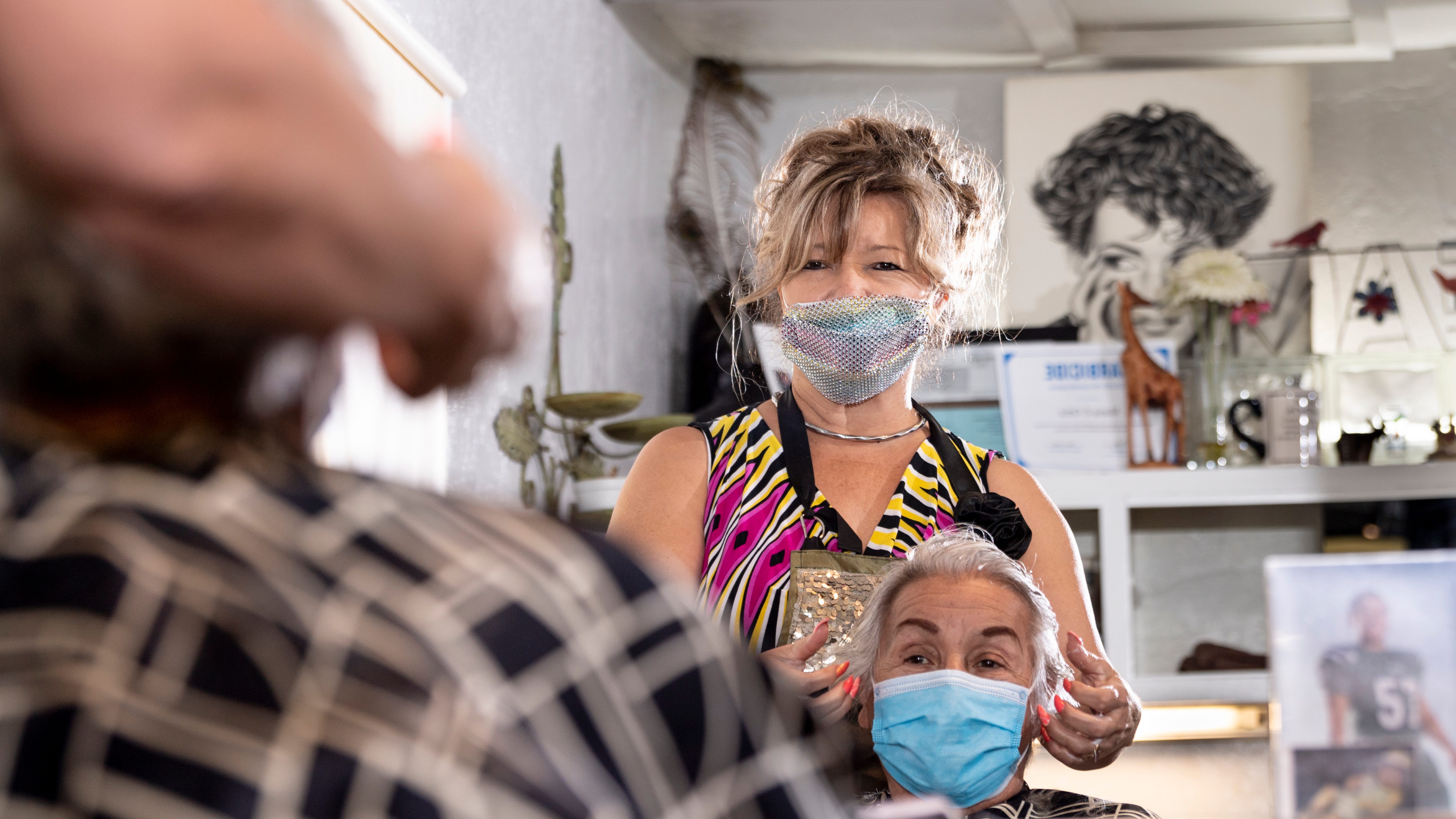 Salon de Maria owner Maria Ortiz works with Elsie Vela on Thursday, May 28, 2020. Ortiz reopened her Visalia shop after Tulare County received approval from the California Department of Public Health (CDPH) to move fully into Stage Two of California's Resilience Roadmap.