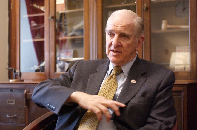 Rep. Sam Johnson, R-Texas, gestures during an interview in his Capitol Hill office Tuesday, Feb. 11, 2003.