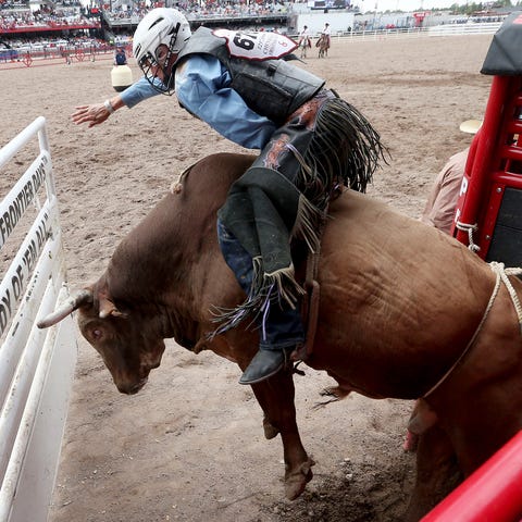 J.T. Moore, of Alvin, Texas, competes in bull ridi