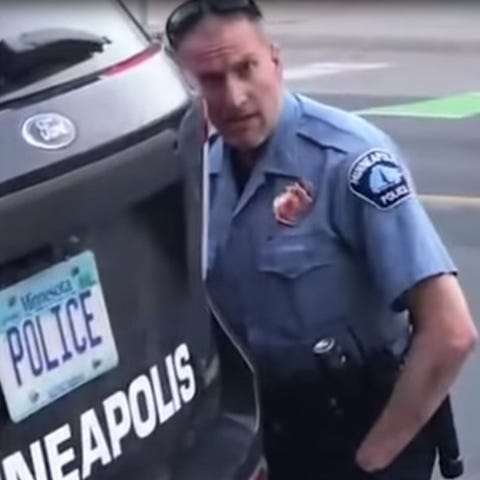 Minneapolis Police officer Derek Chauvin pins Geor