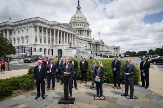 Surrounded by fellow House Republican members, House Minority Leader Rep. Kevin McCarthy (R-CA) speaks during a news conference outside the U.S. Capitol, May 27, 2020 in Washington, DC. Calling it unconstitutional, Republican leaders have filed a lawsuit against House Speaker Nancy Pelosi and congressional officials in an effort to block the House of Representatives from using a proxy voting system to allow for remote voting during the coronavirus pandemic.