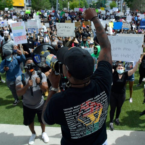 Demonstrators protest in Centennial Olympic Park, 