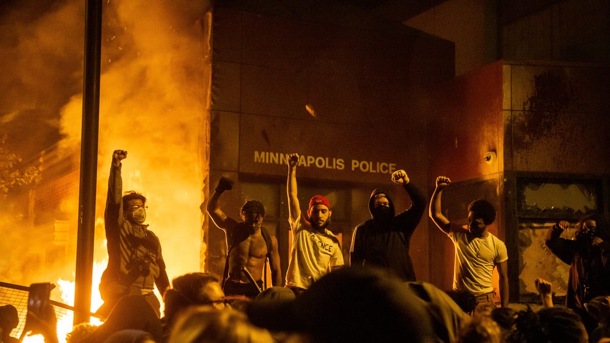 Protesters set the Minneapolis Police Department's 3rd precinct building ablaze on Thursday night.