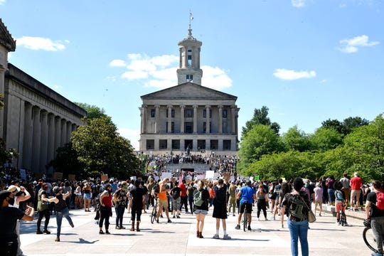People gather on Legislative Plaza in Nashville, Tenn., Saturday, May 30, 2020 for the “I Will Breathe” rally to protest the death of George Floyd, an unarmed black man who died after being pinned down by a white Minneapolis police officer on Memorial Day.