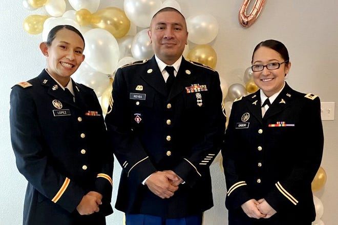 Newly commissioned officers 2nd Lt. Brisa Lopez, left, and 2nd Lt. Justice Cordero with Staff Sgt. Adan Reyes, Army Reserve 900th quartermaster company, at the New Mexico State University Army ROTC commissioning ceremony.
