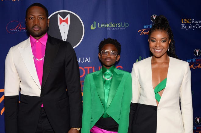Dwyane Wade (left) and Gabrielle Union (right) have been outspoken, fierce advocates for their daughter, Zaya Wade (center).
