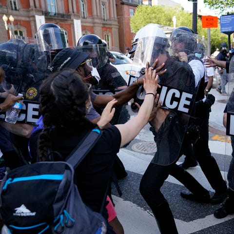 Demonstrators clash with police as they protest th