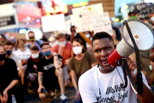 Devante Hill leads a demonstration on a march from FedExForum to the National Civil Rights Museum in reaction to the recent death of George Floyd on Friday, May 29, 2020.