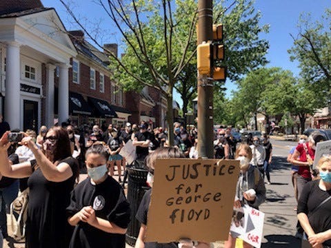 More than 300 residents of Haddonfield and surrounding communities peacefully demonstrate Sunday in Colonial downtown Haddonfield to support justice and protest violence against people of color following recent death of black victim George Floyd restrained by Minneapolis police last week.