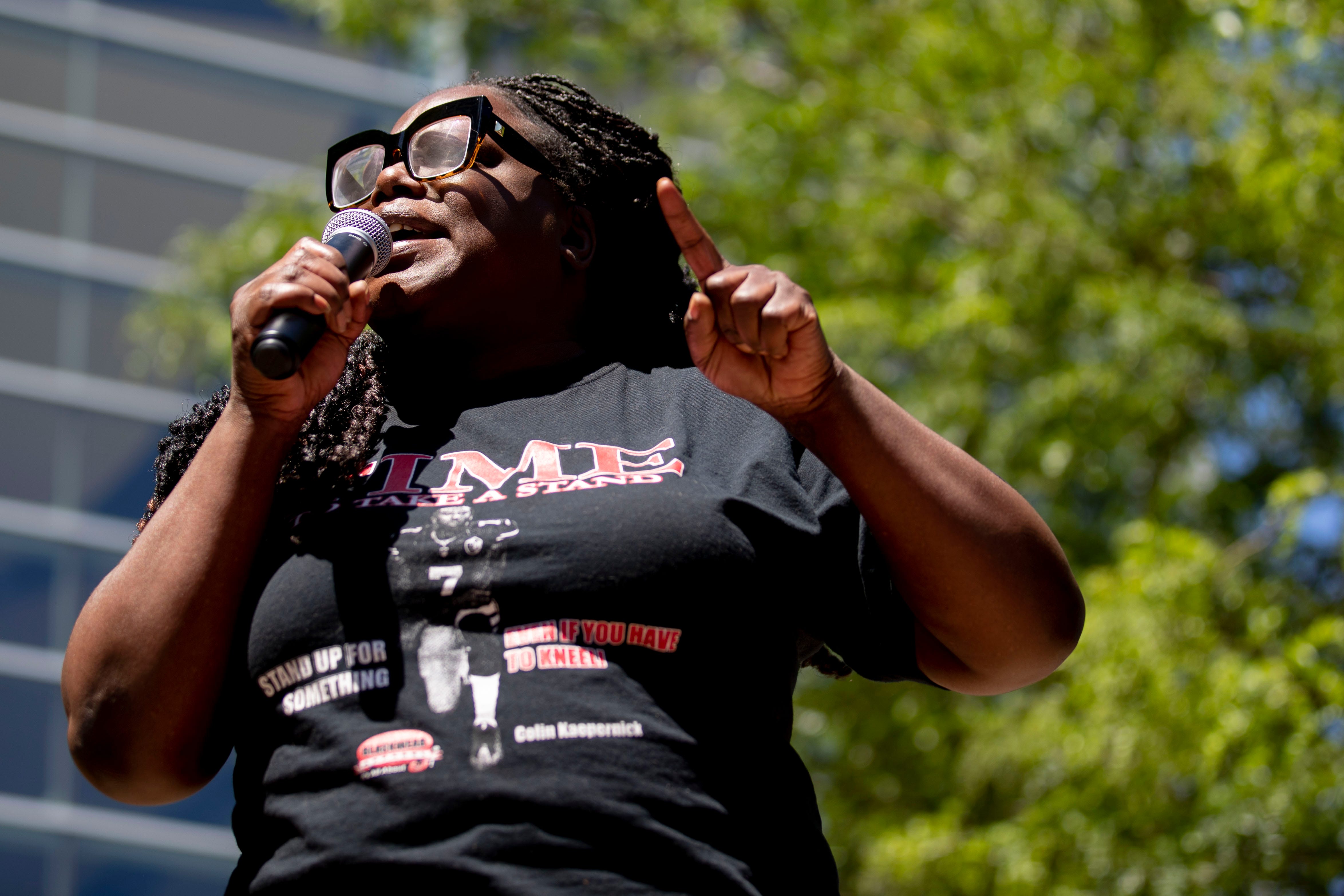 Hannah Drake recites spoken word Sunday, May 31, 2020, during a Black Lives Matter healing rally in front of the KFC Yum Center in downtown Louisville, Ky.