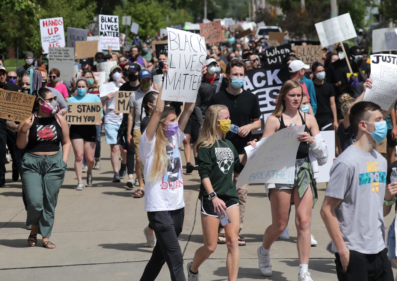 Protesters gather for a Black Lives Matter march and rally on Sunday, May 31, 2020, in Oshkosh, Wis. Protests have been happening across the country this week, after George Floyd, a 46-year-old black man, was killed Monday by a white Minneapolis police officer who knelt on his neck while arresting him.