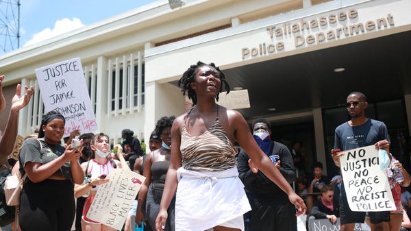 Oluwatoyin Salau, 19, speaks in front of the Talla