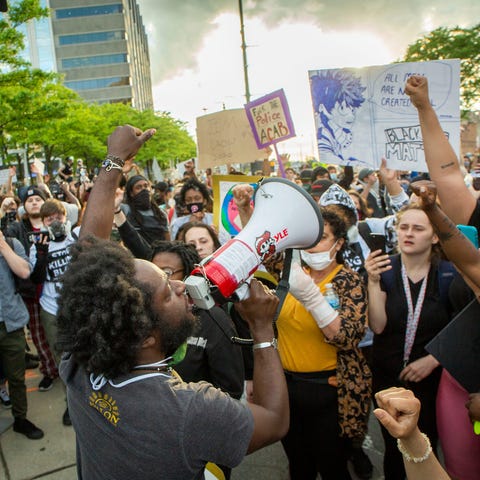 Protesters in downtown Detroit march and stop at t