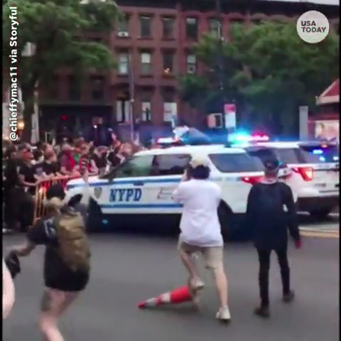 During a protest in New York, an NYPD SUV can be s