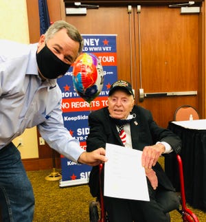 St. George Mayor Jon Pike, left, met with Sidney Walton, a World War II veteran, on the 101-year-old's way to Salt Lake City during a nationwide tour meeting with state governors and other leaders.